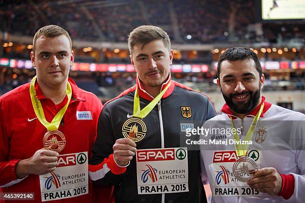 David Storl of Germany, Ladislav Prasil of the Czech Republic and Asmir Kolasinac of Serbia pose for photographers after medal ceremony after Shot...