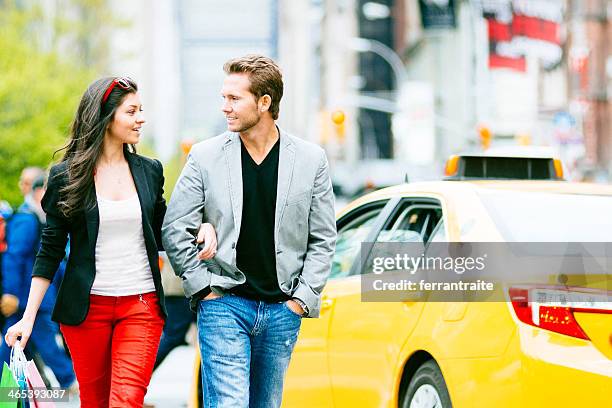 young couple shopping in new york city - union square new york city stock pictures, royalty-free photos & images