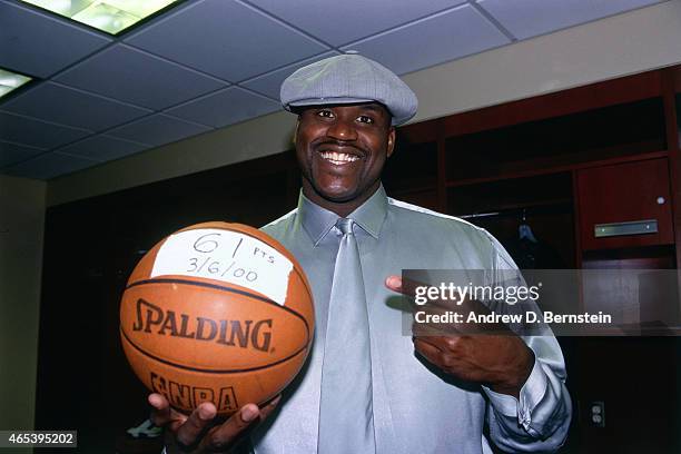 Shaquille O'Neal of the Los Angeles Lakers poses with a basketball against the Los Angeles Clippers on March 6, 2000 at Staples Center in Los...