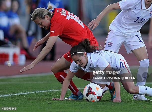 Midfielder Morgan Brian vies with Switzerland's midfielder Vanessa Burki during the Algarve Cup football match USA vs Switzerland at the Estadio...