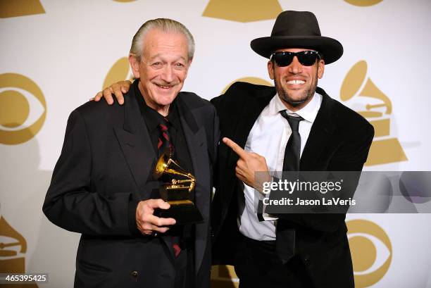 Musicians Charlie Musselwhite and Ben Harper, winners of the Best Blues Album award for 'Get Up!,' pose in the press room at the 56th GRAMMY Awards...