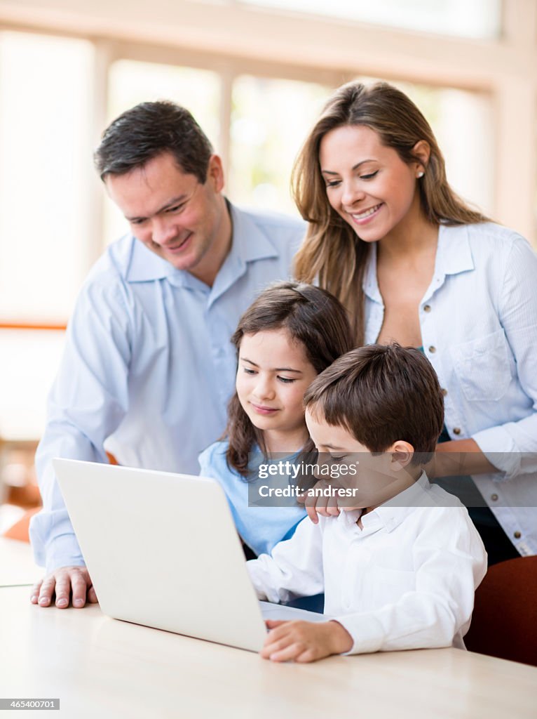 Familly Computer Family Using The Computer At Home High-Res Stock Photo - Getty Images