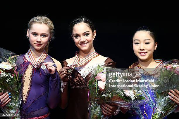 Gold medalist Evgenia Medvedeva , Silver medalist Serafima Sakhanovich of Russia and Bronze medalist Wakaba Higuchi of Japan pose for a picture after...