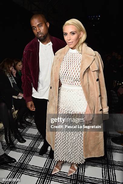 Kim Kardashian West and Kanye West attend the Balenciaga show as part of the Paris Fashion Week Womenswear Fall/Winter 2015/2016 on March 6, 2015 in...