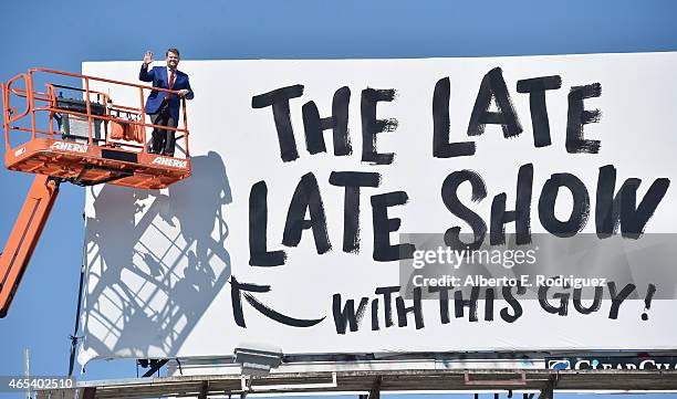 Actor/host James Corden puts up his own billboard for CBS Television Network's "The Late Late Show" on March 6, 2015 in Los Angeles, California.