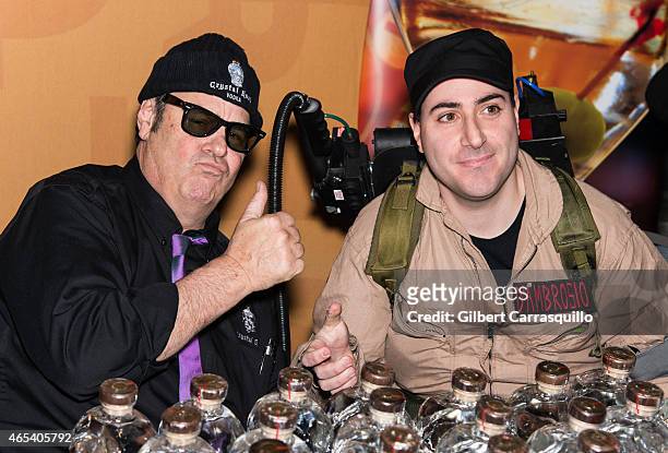 Actor Dan Aykroyd poses with fan during Crystal Head Vodka bottle signing during 186th PHS Philadelphia Flower Show, 'Celebrate the Movies', at...