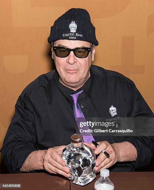 Actor Dan Aykroyd signs bottles of Crystal Head Vodka during 186th PHS Philadelphia Flower Show, 'Celebrate the Movies', at Pennsylvania Convention...