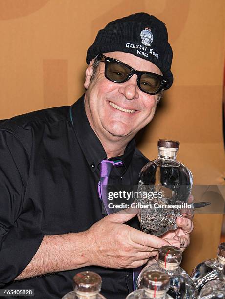 Actor Dan Aykroyd signs bottles of Crystal Head Vodka during 186th PHS Philadelphia Flower Show, 'Celebrate the Movies', at Pennsylvania Convention...