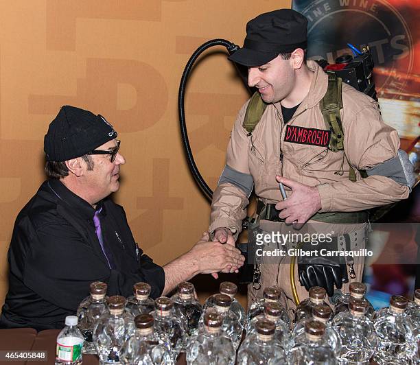 Actor Dan Aykroyd poses with fan during Crystal Head Vodka bottle signing during 186th PHS Philadelphia Flower Show, 'Celebrate the Movies', at...