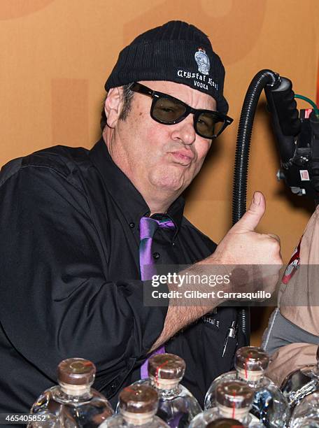 Actor Dan Aykroyd signs bottles of Crystal Head Vodka during 186th PHS Philadelphia Flower Show, 'Celebrate the Movies', at Pennsylvania Convention...