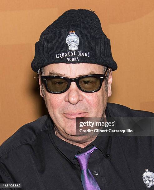 Actor Dan Aykroyd signs bottles of Crystal Head Vodka during 186th PHS Philadelphia Flower Show, 'Celebrate the Movies', at Pennsylvania Convention...