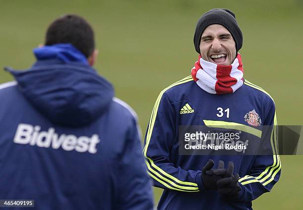 Gus Poyet manager of Sunderland and Fabio Borini reacts during a training session at the clubs Academy of Light on January 27, 2014 in Sunderland,...
