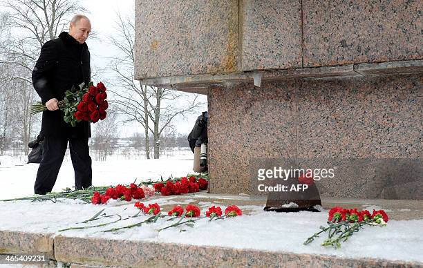 Russia's President Vladimir Putin lays flowers at the war memorial Nevsky Pyatachok , the site of one of the most critical and costly campaigns in...