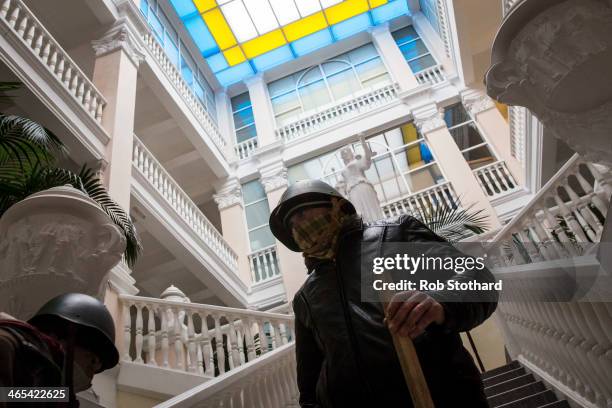 Anti-government protestors stand inside the occupied Ministry of Justice on January 27, 2013 in Kiev, Ukraine. Unrest is spreading across Ukraine,...