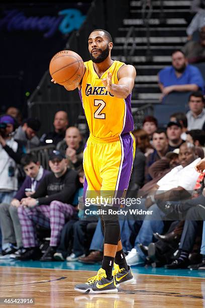 Wayne Ellington of the Los Angeles Lakers passes against the Charlotte Hornets on March 3, 2015 at at Time Warner Cable Arena in Charlotte, North...