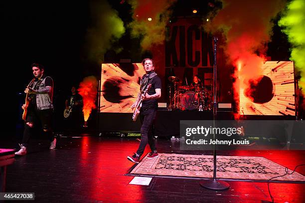 Jack Fowler, Justin Hills and Gabe Barham of Sleeping With Sirens perform at Fillmore Miami Beach on February 24, 2015 in Miami Beach, Florida.