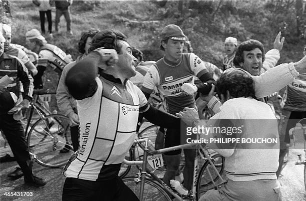 French cyclist Bernard Hinault throws a punch during a miners protest on March 12, 1984. Le coureur français Bernard Hinault donne un coup de poing à...