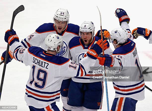 Derek Roy of the Edmonton Oilers celebrates his first period goal with teammates Justin Schultz, Oscar Klefbom and Nail Yakupov against the Chicago...