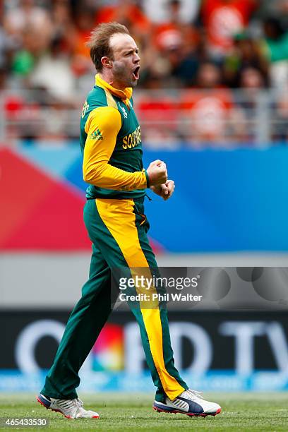 De Villiers of South Africa celebrates his wicket of Younis Khan of Pakistan during the 2015 ICC Cricket World Cup match between South Africa and...