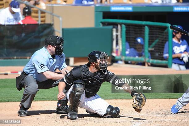 George Kottaras of the Chicago White Sox catches during the game against the Los Angeles Dodgers on March 5, 2015 at Camelback Ranch-Glendale in...