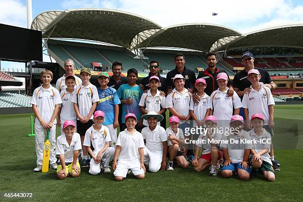 Members of the Bangladesh Cricket team pose for a photograph with kids from the Woodville Rechabite Cricket Club during the ICC Charity Coaching...