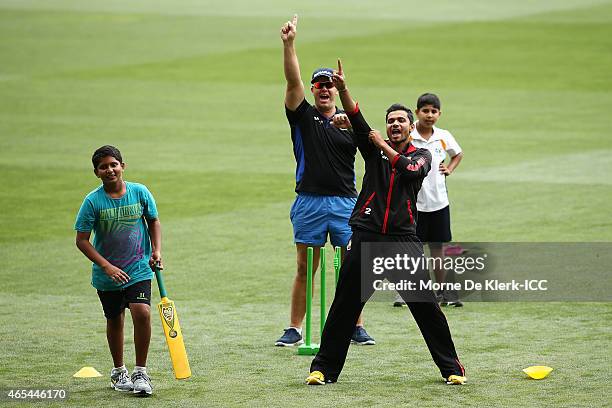 Heath Streak and Mashrafe Bin Mortaza of Bangladesh reacts during the ICC Charity Coaching Clinic at the Adelaide Oval on March 7, 2015 in Adelaide,...