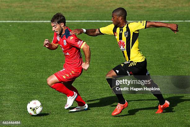 Miguel Palanca of Adelaide United is challenged by Roly Bonevacia of the Phoenix during the round 20 A-League match between the Wellington Phoenix...