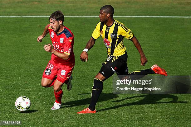 Miguel Palanca of Adelaide United is challenged by Roly Bonevacia of the Phoenix during the round 20 A-League match between the Wellington Phoenix...