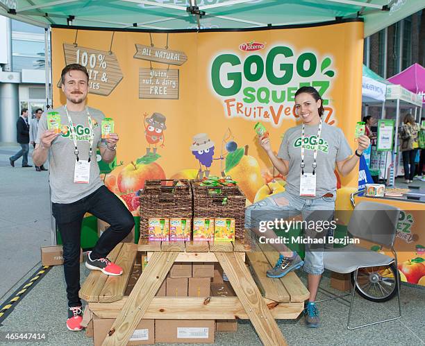 Experiential Marketing Manager Thomas Stinchfield and Squeez Squad Eliana Saenz of GoGo Squeez attend Natural Products Expo West on March 6, 2015 in...