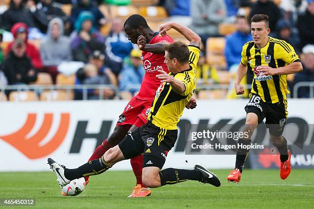 Ben Sigmund of the Phoenix blocks a shot at goal by Bruce Djite of Adelaide United during the round 20 A-League match between the Wellington Phoenix...