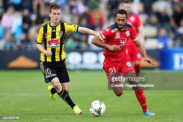 Tarek Elrich of Adelaide United is challenged by Michael McGlinchey of the Phoenix during the round 20 A-League match between the Wellington Phoenix...