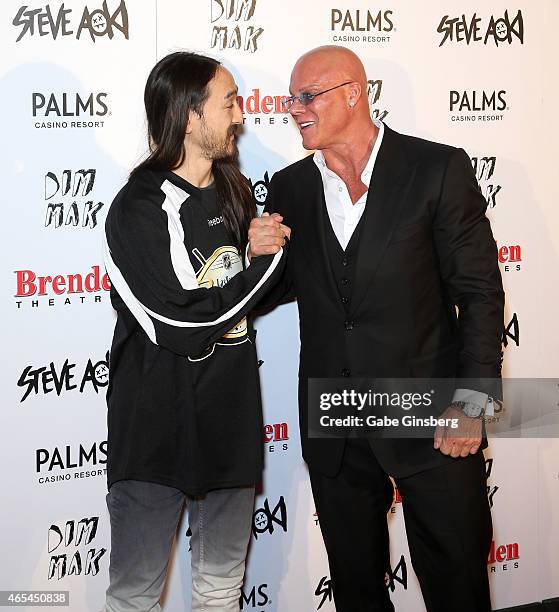 Producer Steve Aoki shakes hands with President and CEO of the Brenden Theatre Corp. Johnny Brenden as they attend the Brenden Celebrity Star...
