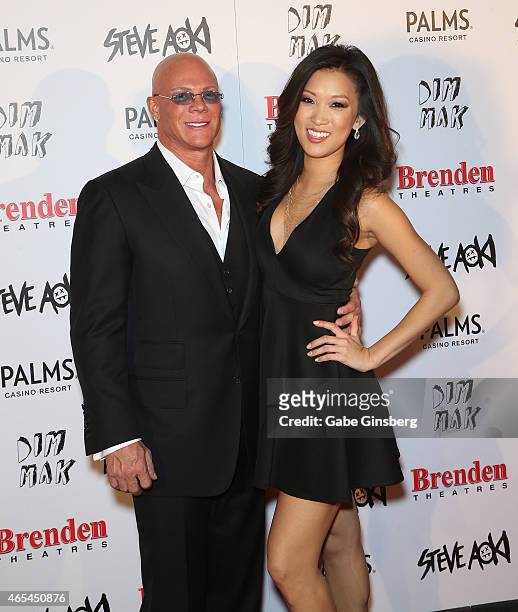 President and CEO of the Brenden Theatre Corp. Johnny Brenden and a guest attend the Brenden Celebrity Star unveiling honoring Steve Aoki at the...