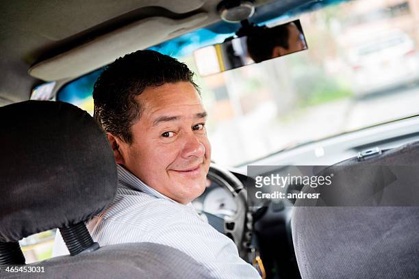 taxi driver in the car - latin american and hispanic ethnicity driver stock pictures, royalty-free photos & images