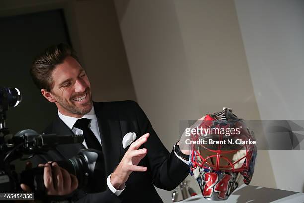 New York Rangers goaltender Henrik Lundqvist speaks with reporters about his custom designed goalie masks during An Evening "Behind The Mask" With...