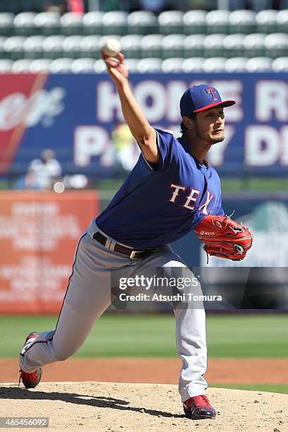 Yu Darvish of the Texas Rangers pitches in the spring training game against the Kansas City Royals at Surprise Stadium on March 5, 2015 in Surprise,...