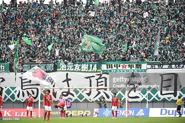 Supporters of Matsumoto Yamaga excited with 3rd goal of Kohei Kiyama of Matsumoto Yamaga during the J. League match between Nagoya Grampus and...