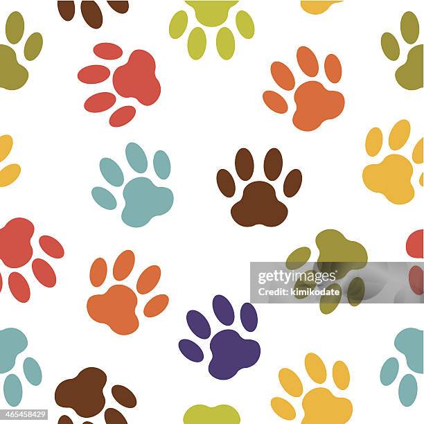 colorful dog paw print vector pattern - paw print stock illustrations