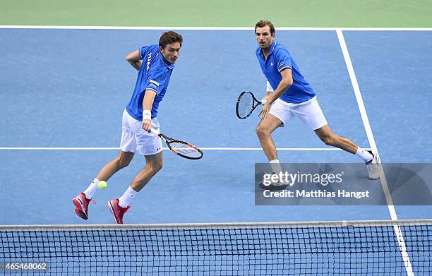Julien Benneteau and Nicolas Mahut of France in action against Benjamin Becker and Andre Begemann of Germany in their doubles match during day two of...