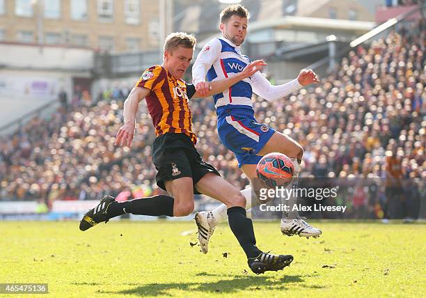 Stephen Darby of Bradford City takes a shot on goal under pressure from Oliver Norwood of Reading during the FA Cup Quarter Final match between...