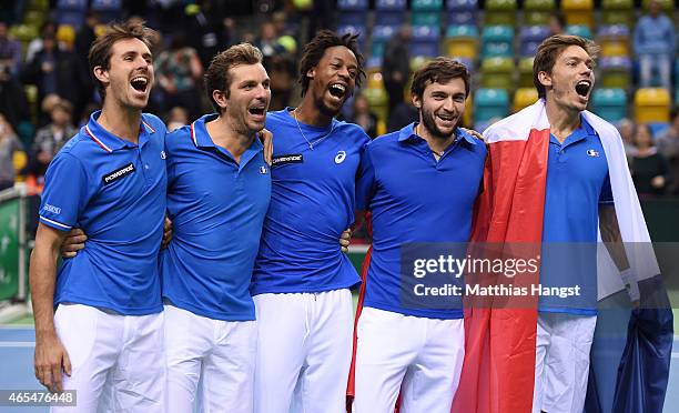 Edouard Roger-Vasselin, Julien Benneteau, Gael Monfils, Gilles Simon and Nicolas Mahut of France celebrate after the decisive doubles match during...