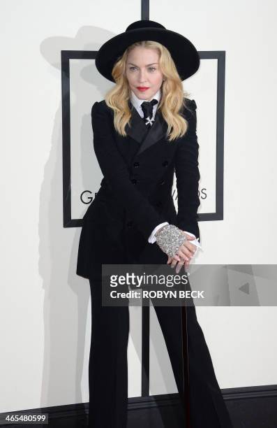 Madonna arrives on the red carpet for the 56th Grammy Awards at the Staples Center in Los Angeles on January 26, 2014. AFP PHOTO/ROBYN BECK