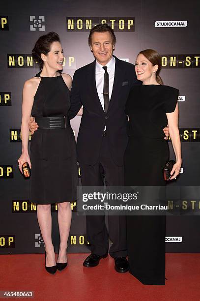 Michelle Dockery, Liam Neeson and Julianne Moore attend the 'Non Stop' Paris Premiere at Cinema Gaumont Opera on January 27, 2014 in Paris, France.