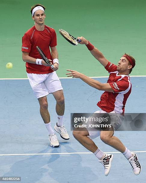 Switzerland's Michael Lammer and Adrien Bossel play against Belgium's Ruben Bemelmans and Niels Desein during the Davis Cup first round World Group...