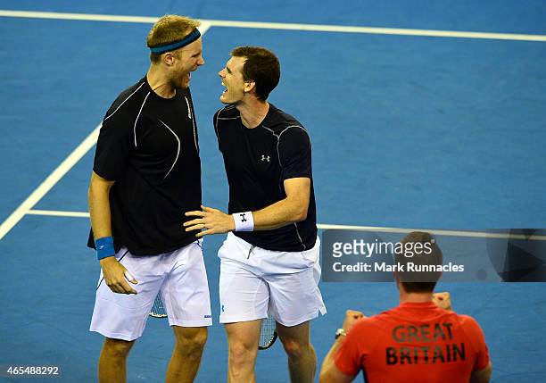 Jamie Murray and Dominic Inglot of the Aegon GB Davis Cup Team celebrate winning the fourth set against Mike Bryan and Bob Bryan of the United States...