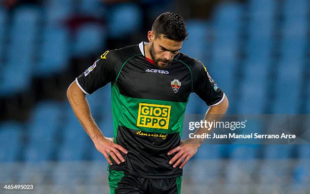 Alberto Botia of Elche FC reacts during the La Liga match between Real Sociedad de Futbol and Elche FC at Estadio Anoeta on January 27, 2014 in San...