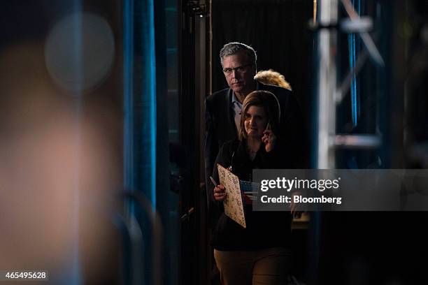 Jeb Bush, former governor of Florida, walks backstage prior to speaking at the Iowa Ag Summit at the Iowa State Fairgrounds in Des Moines, Iowa,...