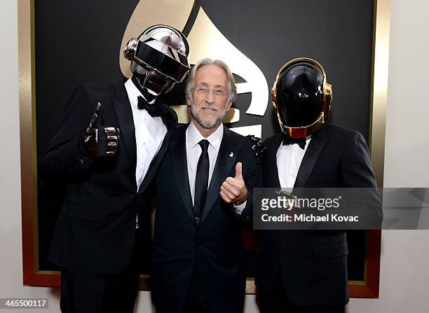 President of the National Academy of Recording Arts and Sciences Neil Portnow and musical group Daft Punk attend the 56th GRAMMY Awards at Staples...