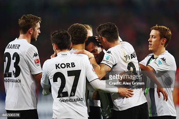 Raffael of Moenchengladbach celebrates his team's first goal with team mates during the Bundesliga match between 1. FSV Mainz 05 and Borussia...