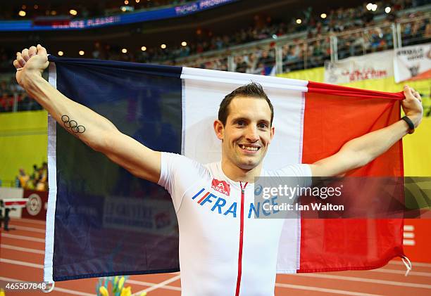 Renaud Lavillenie of France wins gold in the Men's Pole Vault Final during day two of the 2015 European Athletics Indoor Championships at O2 Arena on...